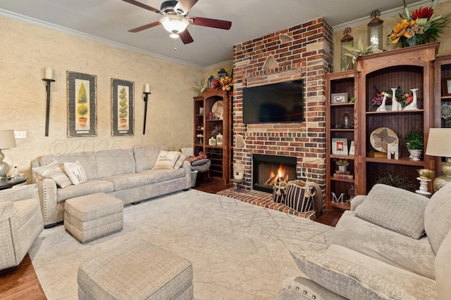 6004 Glenwood Dr, Amarillo, TX 79119 - living area with wood finished floors, ceiling fan, crown molding, and a fireplace