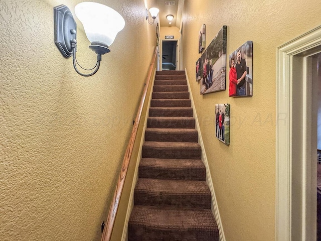 6004 Glenwood Dr, Amarillo, TX 79119 - staircase with a textured wall and baseboards