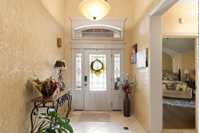 6004 Glenwood Dr, Amarillo, TX 79119 - entrance foyer featuring light tile patterned floors and a textured wall