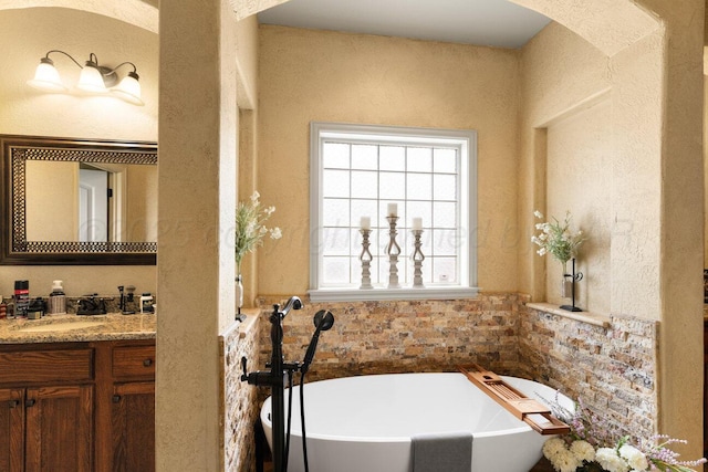 6004 Glenwood Dr, Amarillo, TX 79119 - full bath with a freestanding bath, vanity, and a wainscoted wall