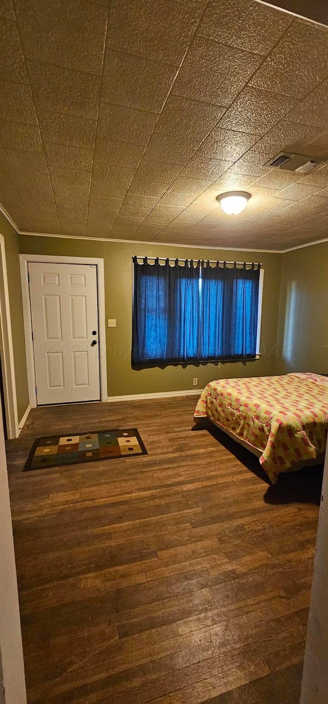 unfurnished bedroom with hardwood / wood-style floors