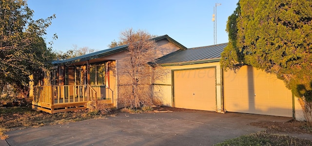 view of side of home featuring a garage