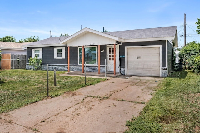 2902 Pryor St, Amarillo, TX 79103 - ranch-style house featuring concrete driveway, a garage, a porch, and a shingled roof