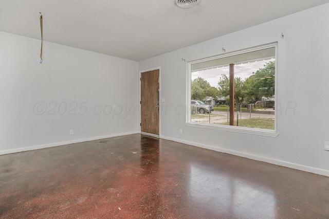 2902 Pryor St, Amarillo, TX 79103 - spare room featuring concrete floors and baseboards