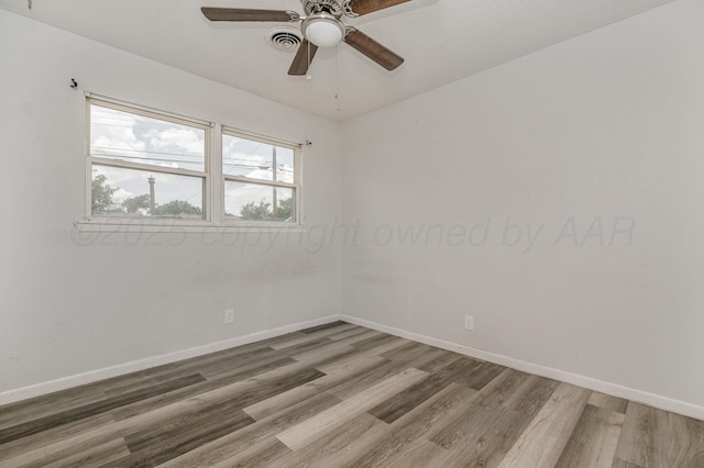 2902 Pryor St, Amarillo, TX 79103 - empty room with wood finished floors and a ceiling fan