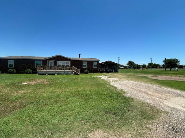 712 Groom Ave, Panhandle, TX 79068 - manufactured / mobile home with driveway, a deck, a front lawn, and a detached carport