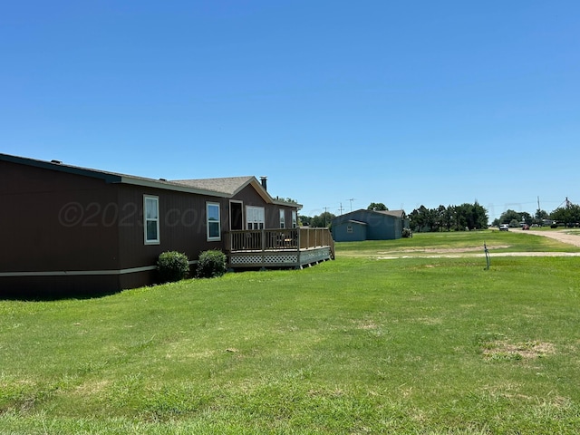 712 Groom Ave, Panhandle, TX 79068 - view of grassy yard with a deck