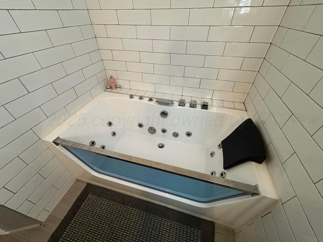 712 Groom Ave, Panhandle, TX 79068 - bathroom with a jetted tub and tile walls