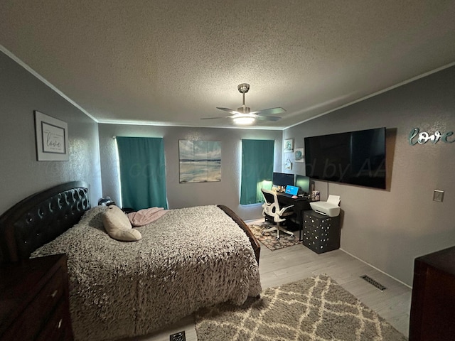 712 Groom Ave, Panhandle, TX 79068 - bedroom featuring crown molding, light wood finished floors, a textured ceiling, an office area, and a ceiling fan