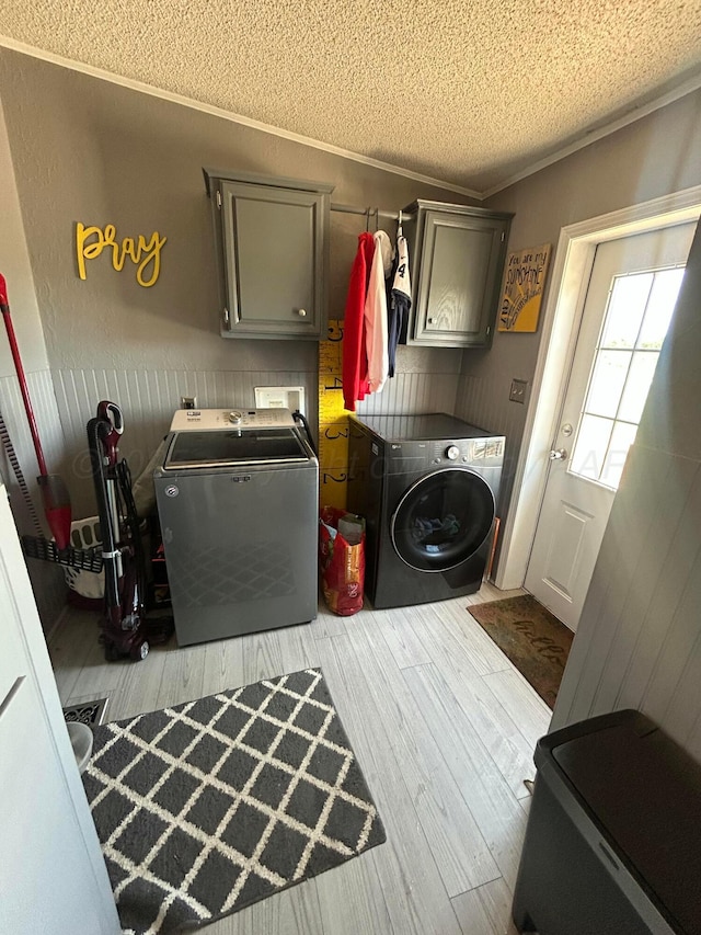 712 Groom Ave, Panhandle, TX 79068 - washroom featuring washing machine and dryer, cabinet space, wood finished floors, a textured ceiling, and crown molding