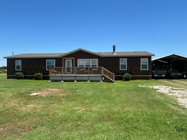 712 Groom Ave, Panhandle, TX 79068 - back of house featuring a carport, a yard, and a deck