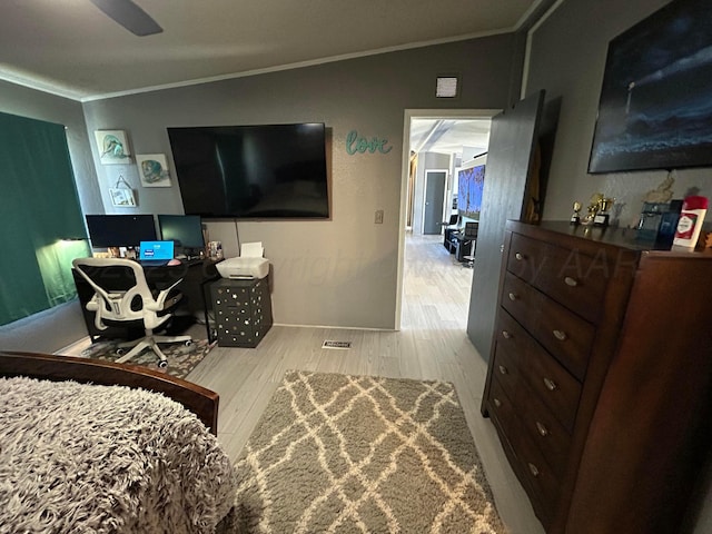 712 Groom Ave, Panhandle, TX 79068 - bedroom with ornamental molding, wood finished floors, a desk, and vaulted ceiling