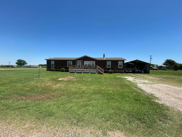 712 Groom Ave, Panhandle, TX 79068 - manufactured / mobile home featuring driveway, a deck, a front lawn, and a detached carport