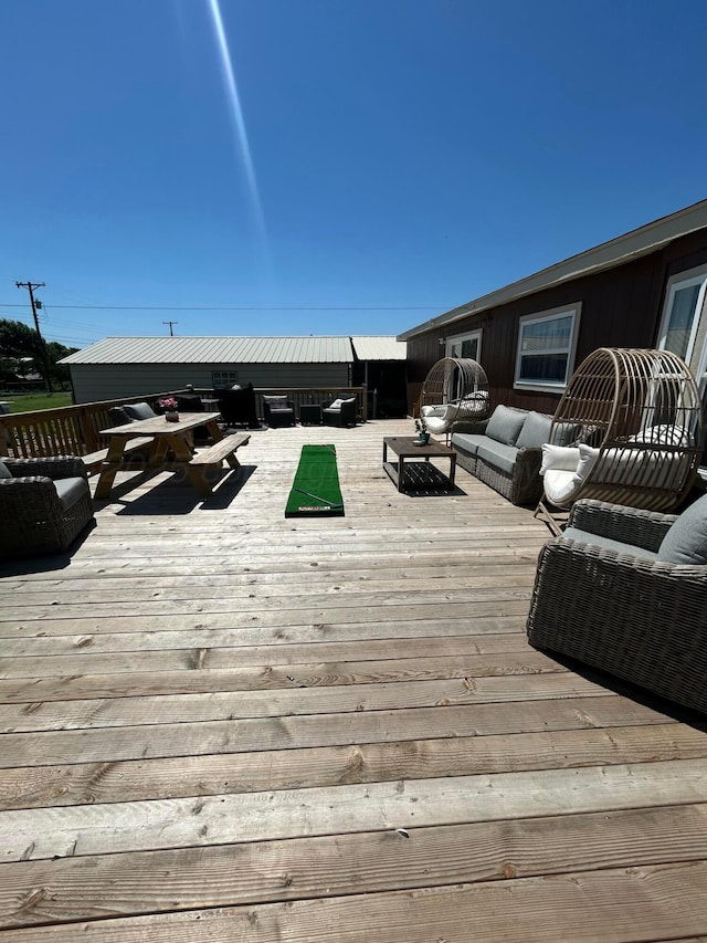 712 Groom Ave, Panhandle, TX 79068 - wooden terrace featuring an outdoor hangout area