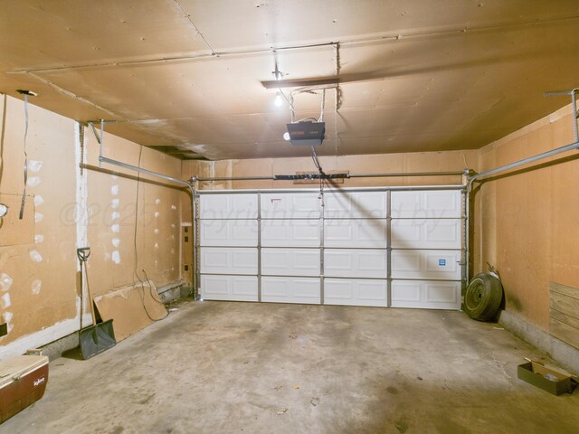 502 Spruce Ave, Dumas, TX 79029 - garage with a garage door opener