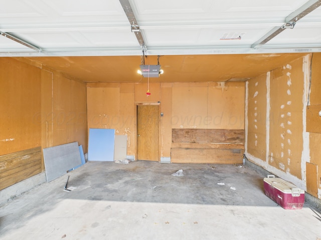 502 Spruce Ave, Dumas, TX 79029 - garage featuring a garage door opener
