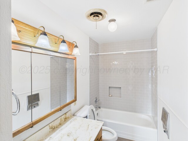 502 Spruce Ave, Dumas, TX 79029 - bathroom featuring vanity, toilet, and bathing tub / shower combination