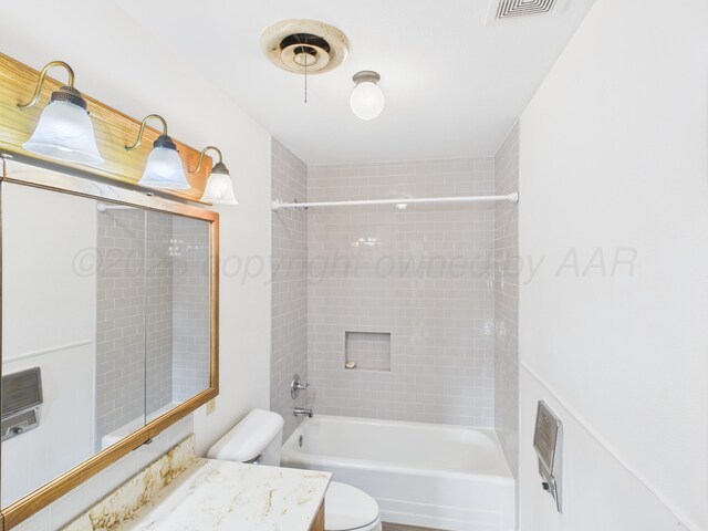 502 Spruce Ave, Dumas, TX 79029 - full bath with vanity,  shower combination, and toilet