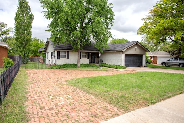 ranch-style home featuring decorative driveway, brick siding, and an attached garage