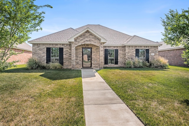 7907 Crestline Dr, Amarillo, TX 79119 - view of front facade featuring brick siding, a front lawn, and roof with shingles