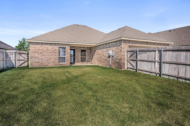7907 Crestline Dr, Amarillo, TX 79119 - back of property featuring brick siding, a fenced backyard, and roof with shingles