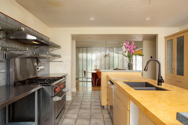 1510 Crockett St, Amarillo, TX 79102 - kitchen featuring stainless steel appliances, light tile patterned floors, and wooden counters