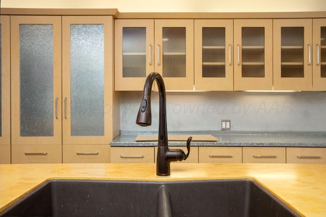 1510 Crockett St, Amarillo, TX 79102 - kitchen featuring decorative backsplash and glass insert cabinets