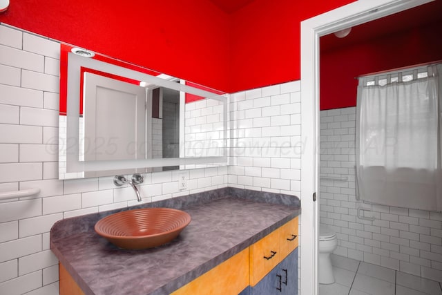 1510 Crockett St, Amarillo, TX 79102 - bathroom with tile walls, vanity, and tile patterned floors