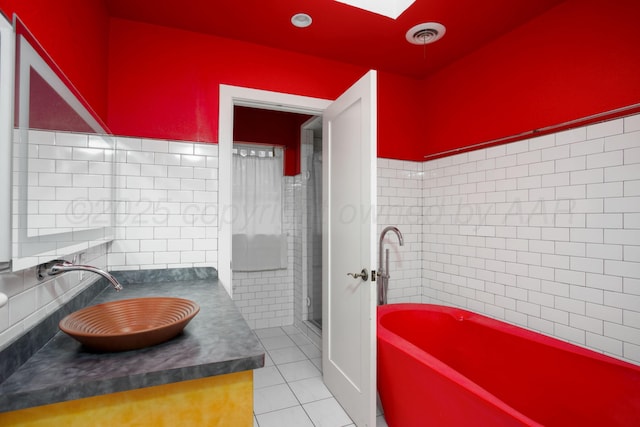 1510 Crockett St, Amarillo, TX 79102 - full bathroom with vanity, tile patterned floors, a skylight, a tub, and a shower