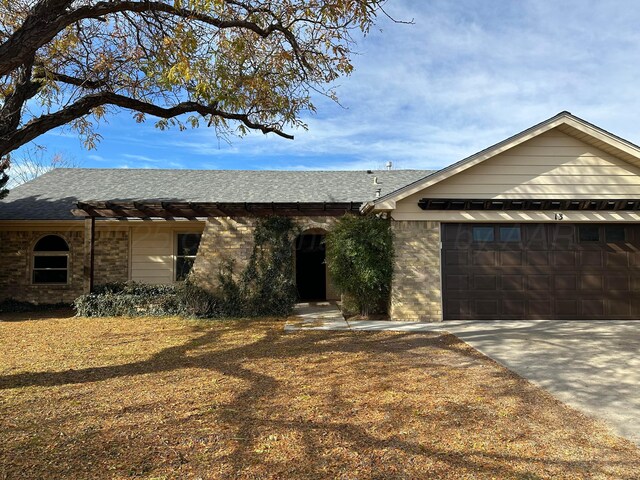 single story home featuring a garage