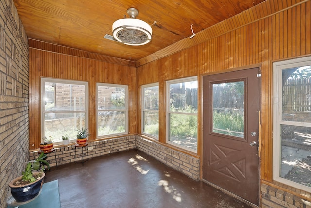 unfurnished sunroom featuring wooden ceiling