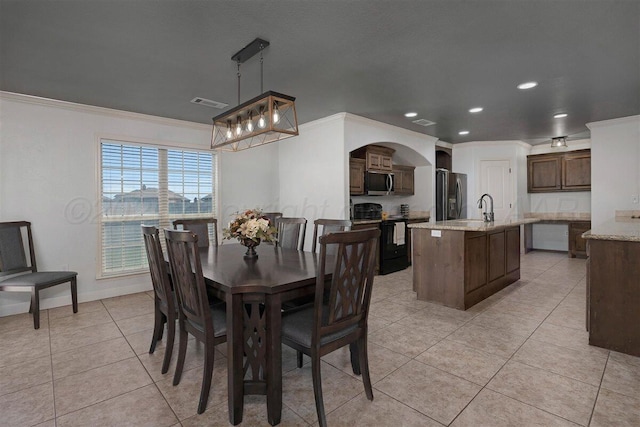 dining space with light tile patterned flooring, visible vents, recessed lighting, an inviting chandelier, and crown molding