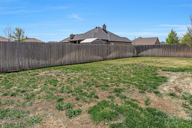 view of yard featuring a fenced backyard