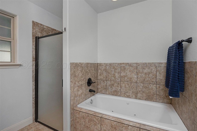 full bathroom with a whirlpool tub and a stall shower