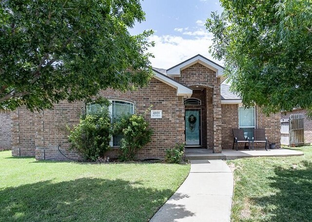4808 Mammoth Ln, Amarillo, TX 79110 - view of front of house featuring a front yard and brick siding