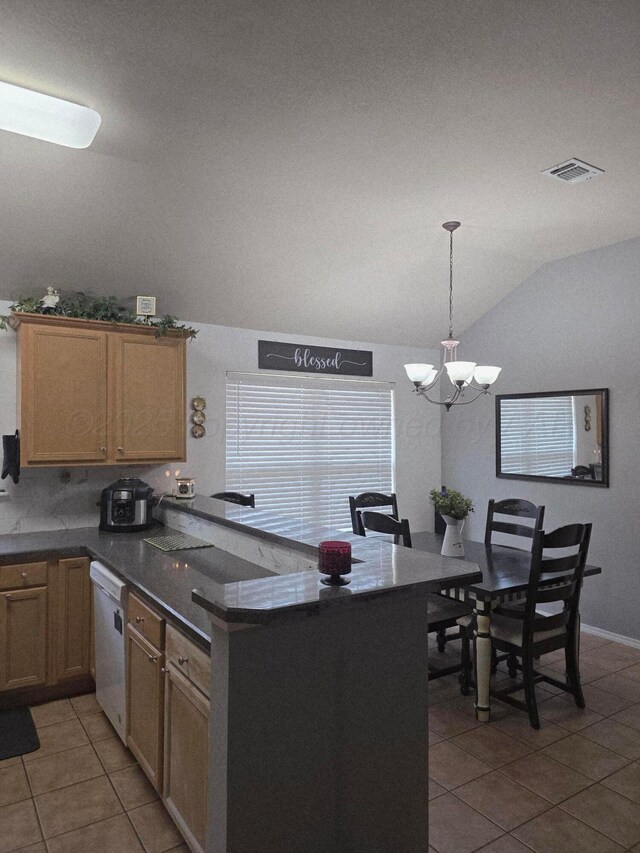 4808 Mammoth Ln, Amarillo, TX 79110 - kitchen with white dishwasher, vaulted ceiling, light tile patterned flooring, a peninsula, and dark countertops