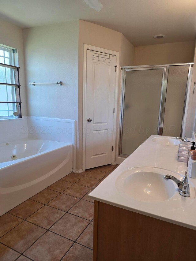 4808 Mammoth Ln, Amarillo, TX 79110 - full bathroom featuring a whirlpool tub, a stall shower, tile patterned floors, and double vanity
