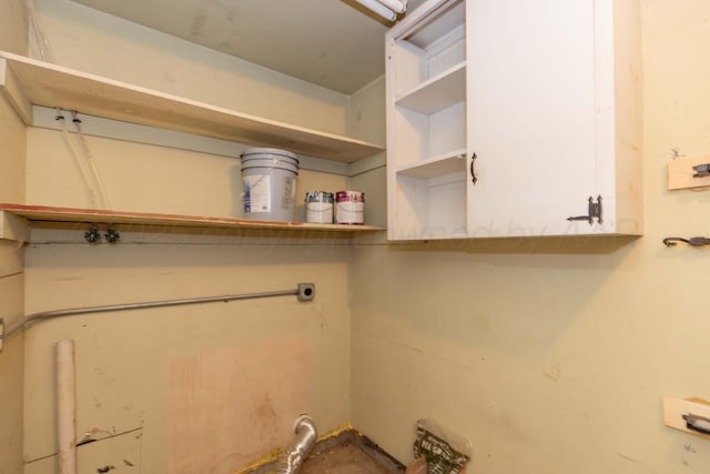 5519 Alvarado Rd, Amarillo, TX 79106 - washroom with electric dryer hookup and cabinet space