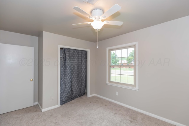 5519 Alvarado Rd, Amarillo, TX 79106 - unfurnished bedroom featuring light carpet, a closet, and ceiling fan