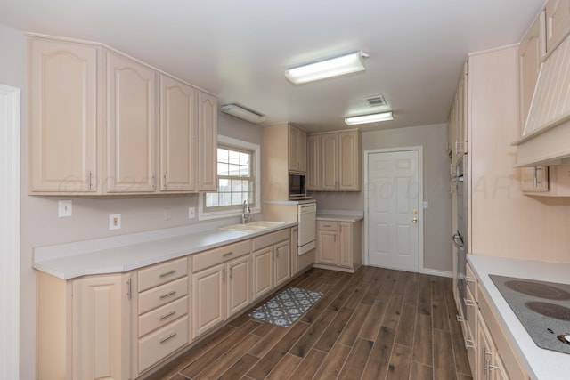 5519 Alvarado Rd, Amarillo, TX 79106 - kitchen with electric cooktop, custom exhaust hood, dark wood-style flooring, white dishwasher, and light countertops