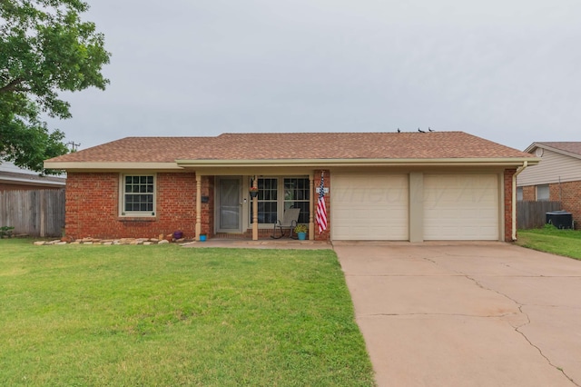 5519 Alvarado Rd, Amarillo, TX 79106 - ranch-style home featuring a garage, brick siding, concrete driveway, and a shingled roof
