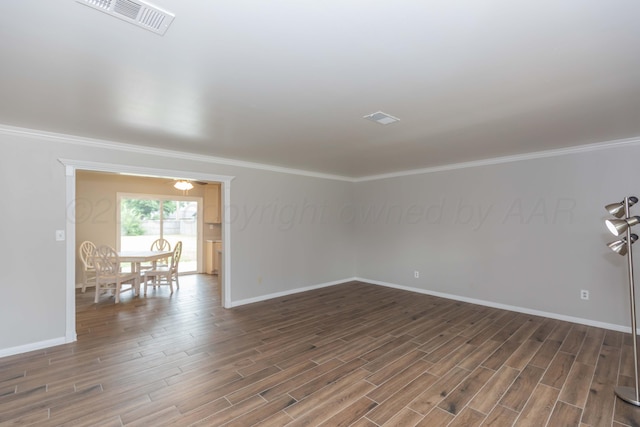 5519 Alvarado Rd, Amarillo, TX 79106 - empty room with wood finished floors and ornamental molding