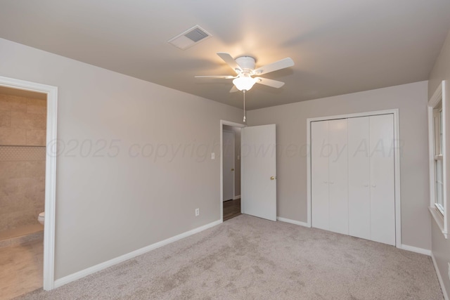 5519 Alvarado Rd, Amarillo, TX 79106 - unfurnished bedroom with carpet flooring, a closet, ceiling fan, and connected bathroom