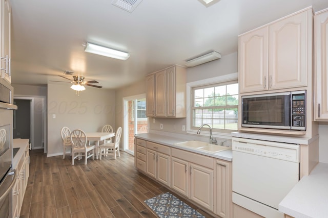 5519 Alvarado Rd, Amarillo, TX 79106 - kitchen with dishwasher, light countertops, dark wood-type flooring, and ceiling fan