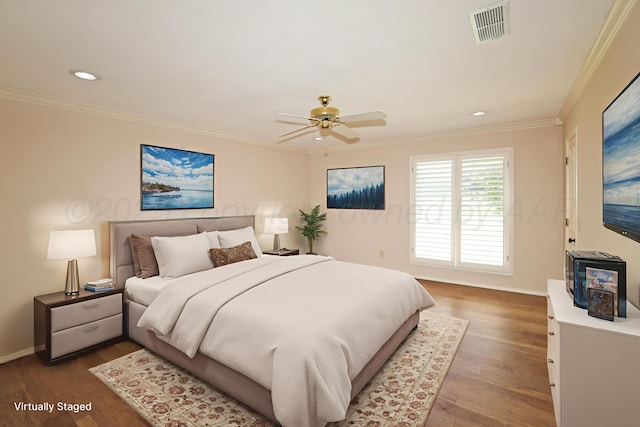 3449 Irving Ln, Amarillo, TX 79121 - bedroom featuring crown molding, dark wood-type flooring, recessed lighting, and a ceiling fan