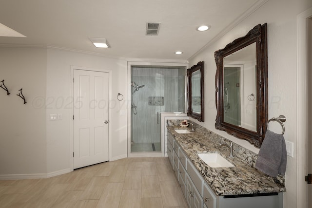 3449 Irving Ln, Amarillo, TX 79121 - bathroom with double vanity, a stall shower, ornamental molding, and recessed lighting