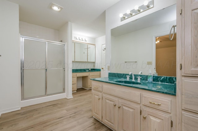 6011 Belpree Rd, Amarillo, TX 79106 - bathroom featuring vanity, a shower stall, and wood finished floors