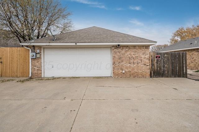 6011 Belpree Rd, Amarillo, TX 79106 - garage featuring a gate and concrete driveway
