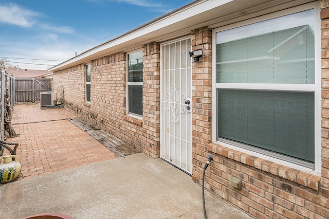 6011 Belpree Rd, Amarillo, TX 79106 - doorway to property with brick siding and a patio area