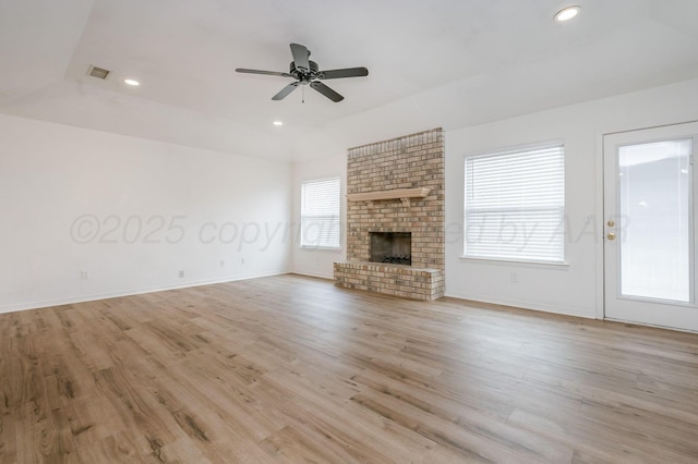 6011 Belpree Rd, Amarillo, TX 79106 - unfurnished living room with ceiling fan, a fireplace, recessed lighting, and light wood finished floors
